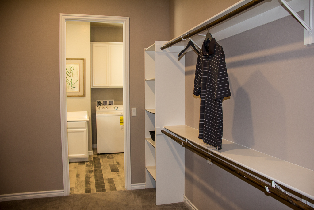 Master closet with door to laundry