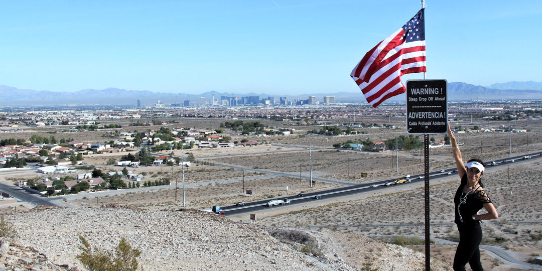 DumpCal things to do Hiker on hill above Las Vegas