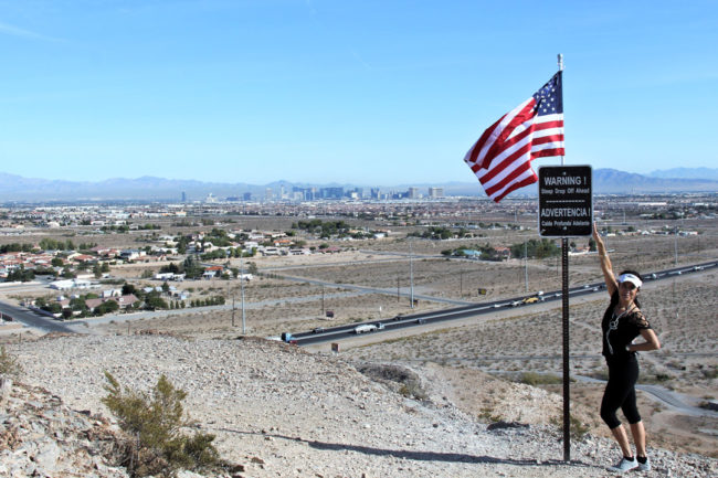 DumpCal things to do Hiker on hill above Las Vegas