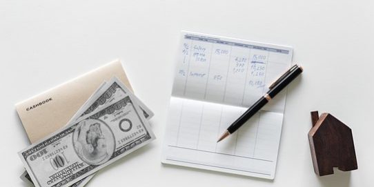 Buying home a good investment, yes or no Money, checkbook, pen